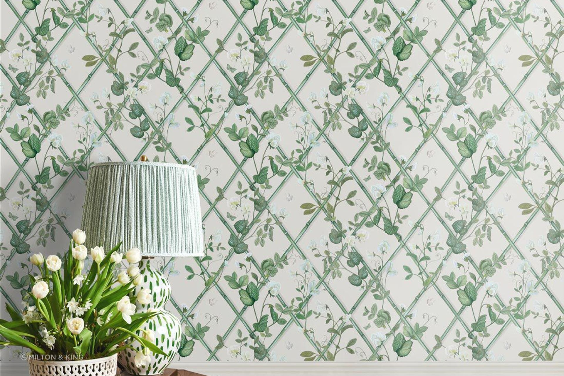 Green against a white backdrop brings freshness to a living room.
