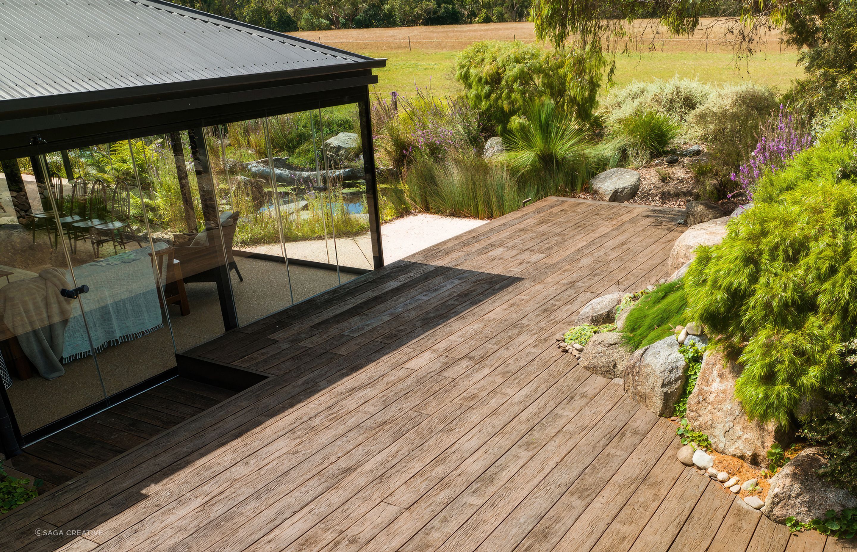 "This incredible garden was designed by award winning landscape designer and horticulturist Phillip Johnson, a winner of the prestigious Chelsea Flower & Garden Show, Best in Show Award. With tranquility and sustainability in mind, the Millboard Vintage Oak decking seamlessly complements the surrounding Native Australian planting."