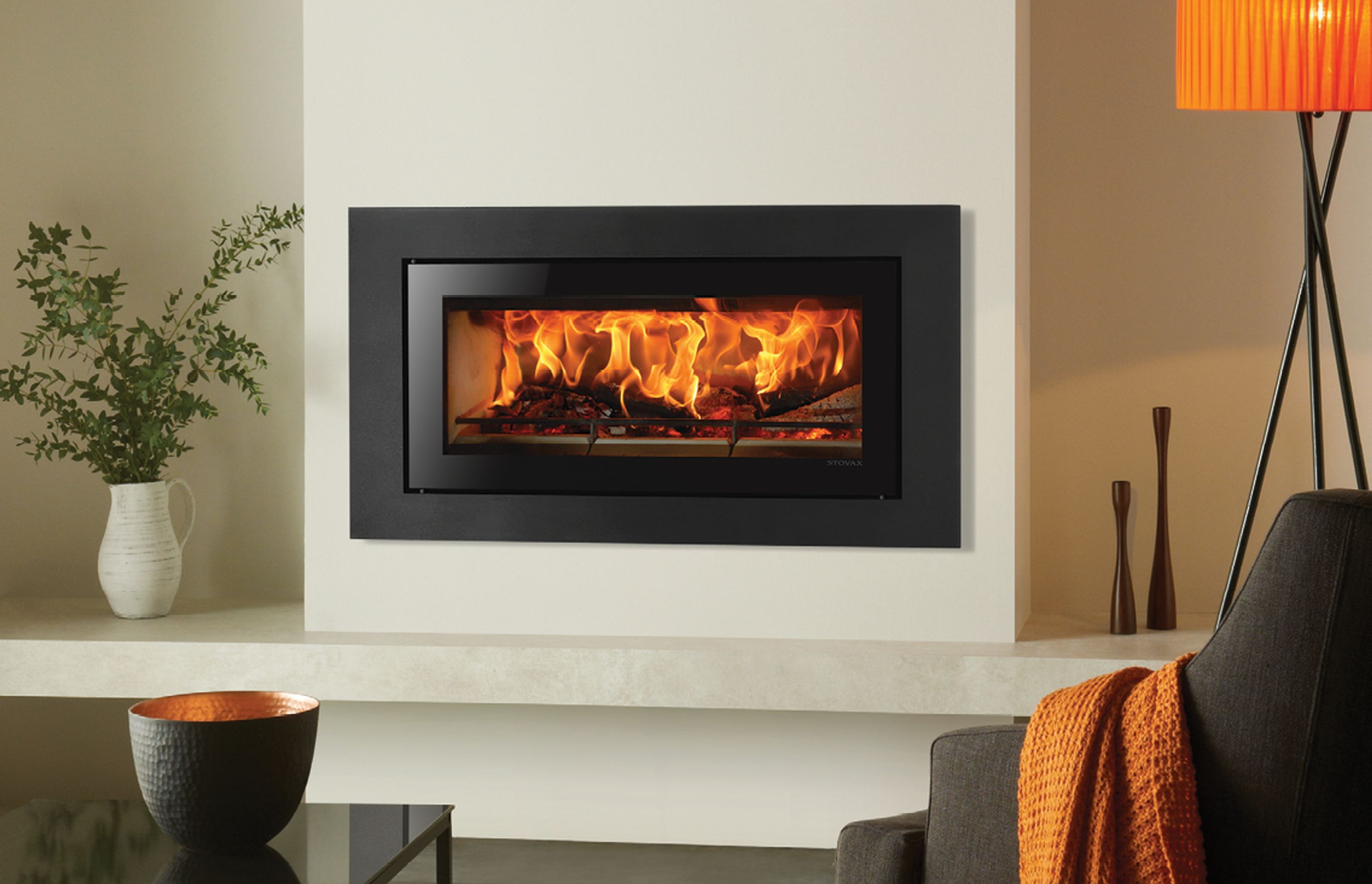 The Stovax Studio 2 Clean Air (urban and rural) inbuilt wood fire features the latest clean-burn combustion system, allowing it to burn logs with outstanding efficiency, resulting in more heat delivery into the room and less going up the chimney.
