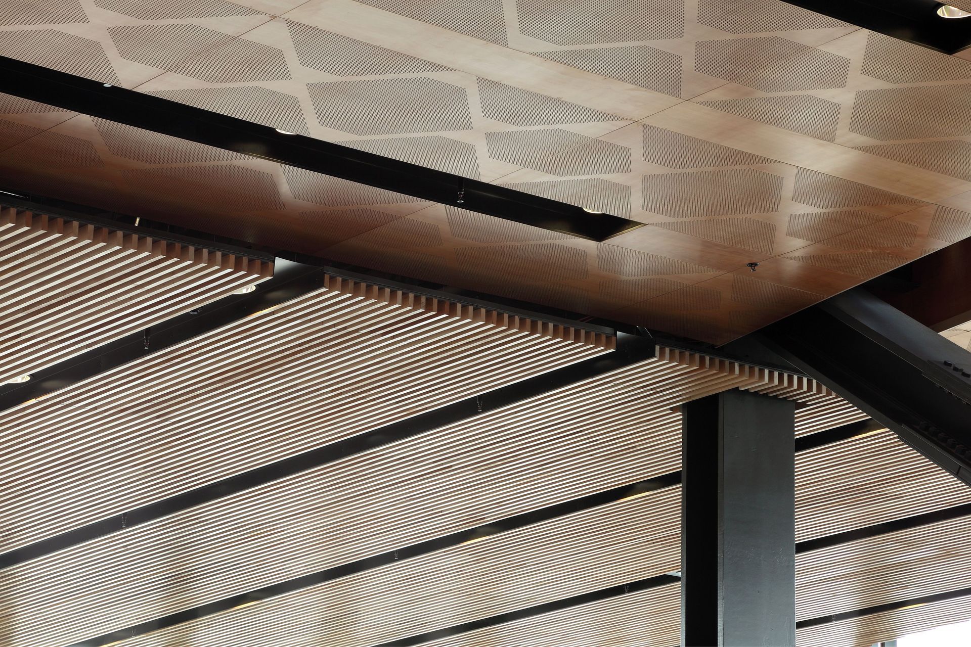 Here, wood is used in a ceiling feature in the Manukau Institute of Technology building, Auckland.