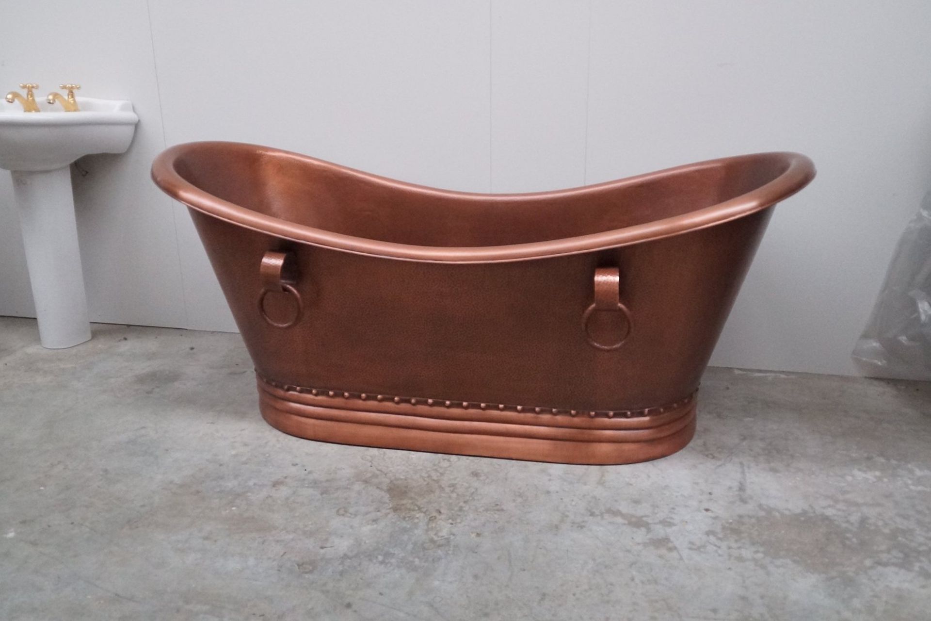 This hammered copper bathtub has unique rustic charm.