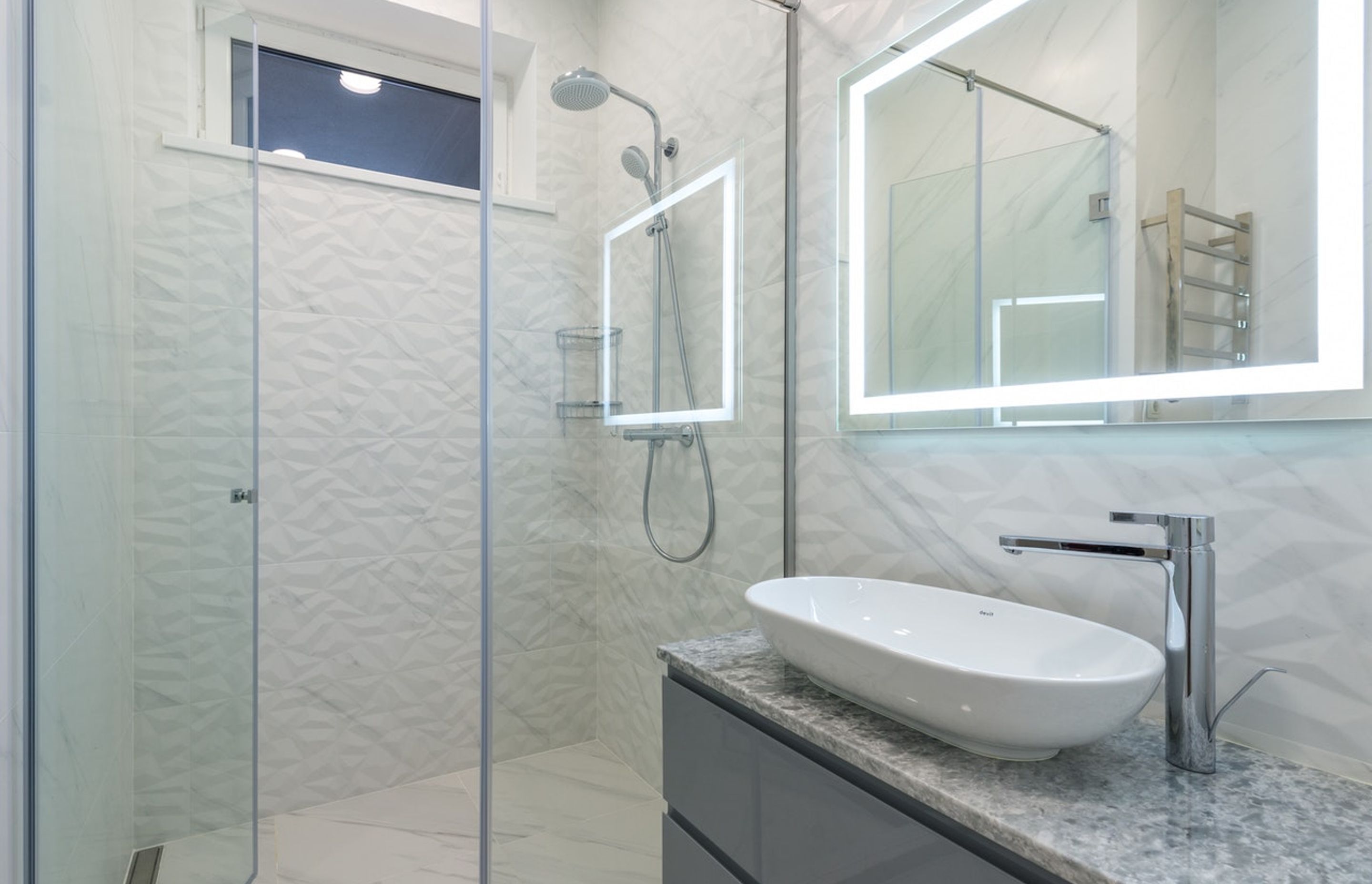 By using glass doors, your shower can act as as an extension of the bathroom space.