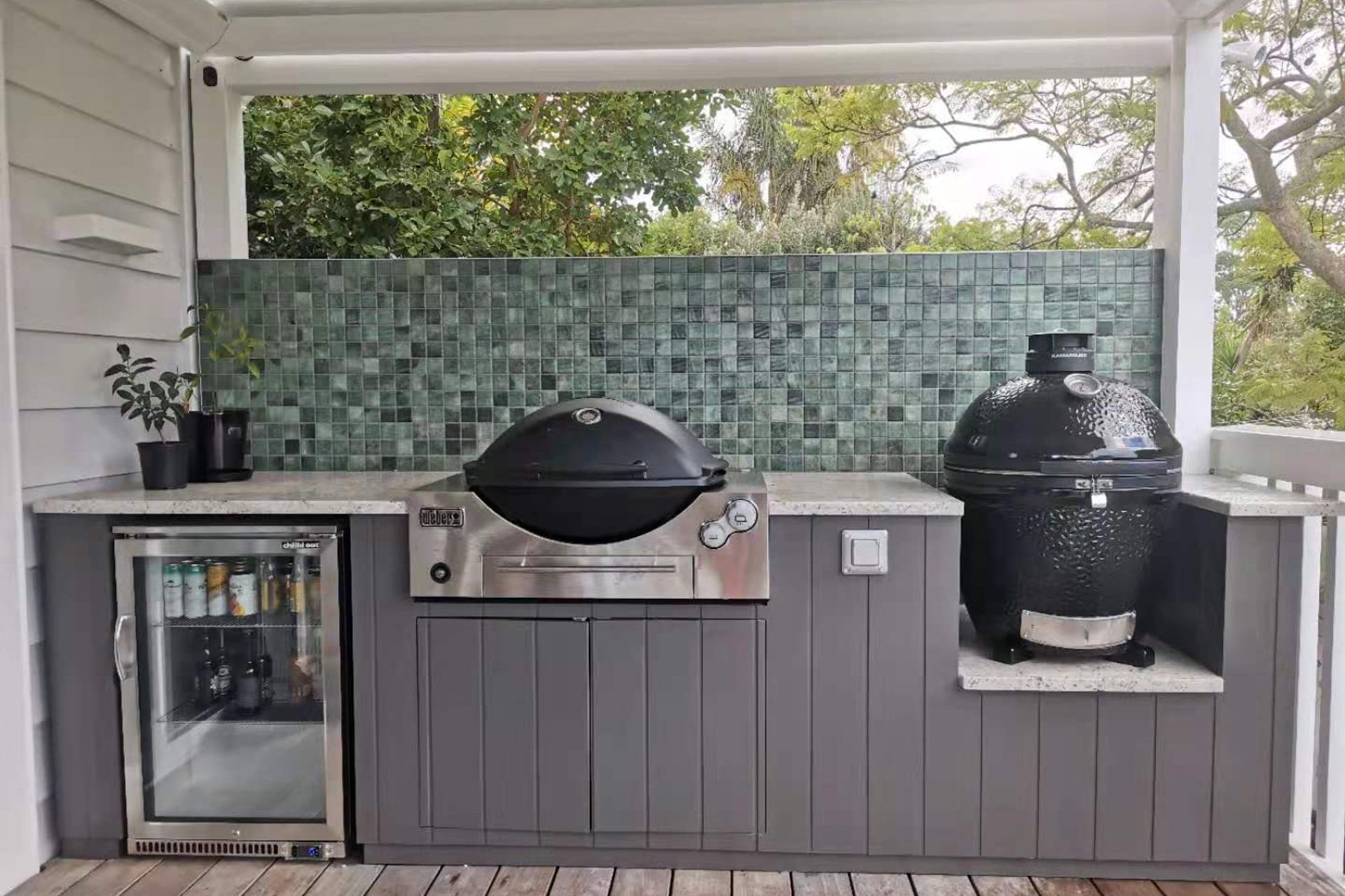 Incorporate a refrigerator, bbq and smoker into your outdoor kitchen for a full culinary experience.