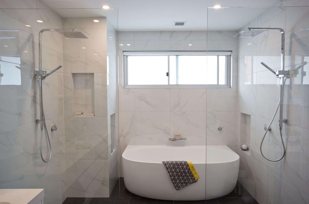 Glass shower screens feature at a first floor addition at Dee Why - Photography: Lachlan Carey