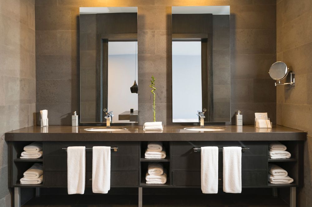 Install Towel Bars on the Outside of Bathroom Cabinet Doors