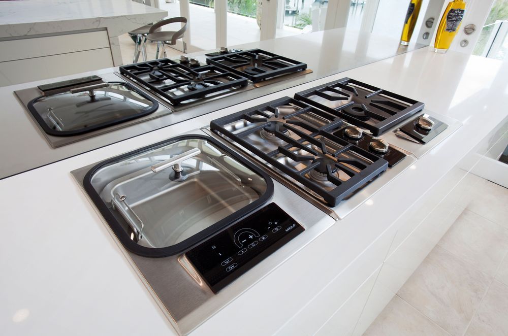 Wolf cooktop modules including a steamer, gas cooktop and wok burner