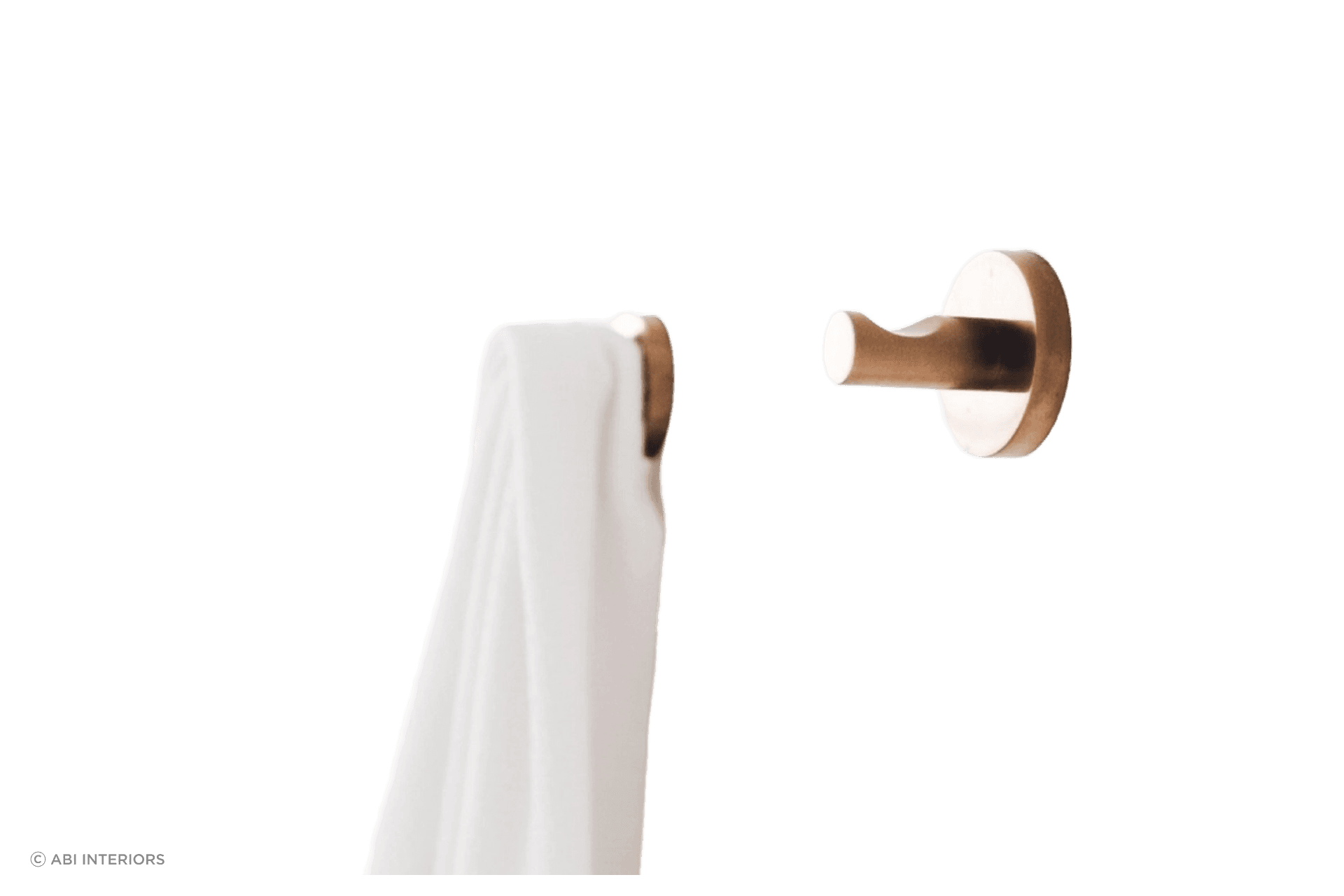 The Elysian Robe Hook in brushed copper offers a sophisticated solution for hanging your robes and towels.