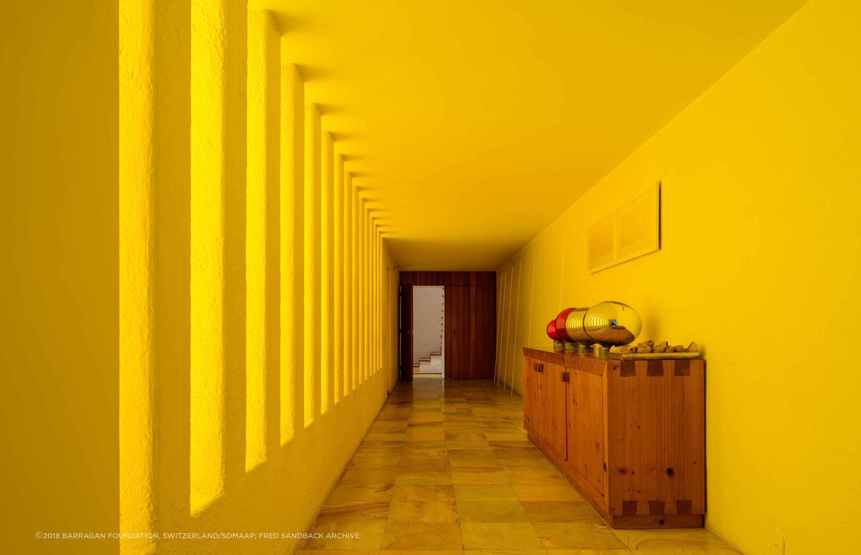 Coloured concrete can be complimented by a clever use of light. At Luis Barragán's Casa Gilardi, only one wall in the pool corridor is yellow, the other is white. Light enters through the adjacent courtyard, creating a warm glow.