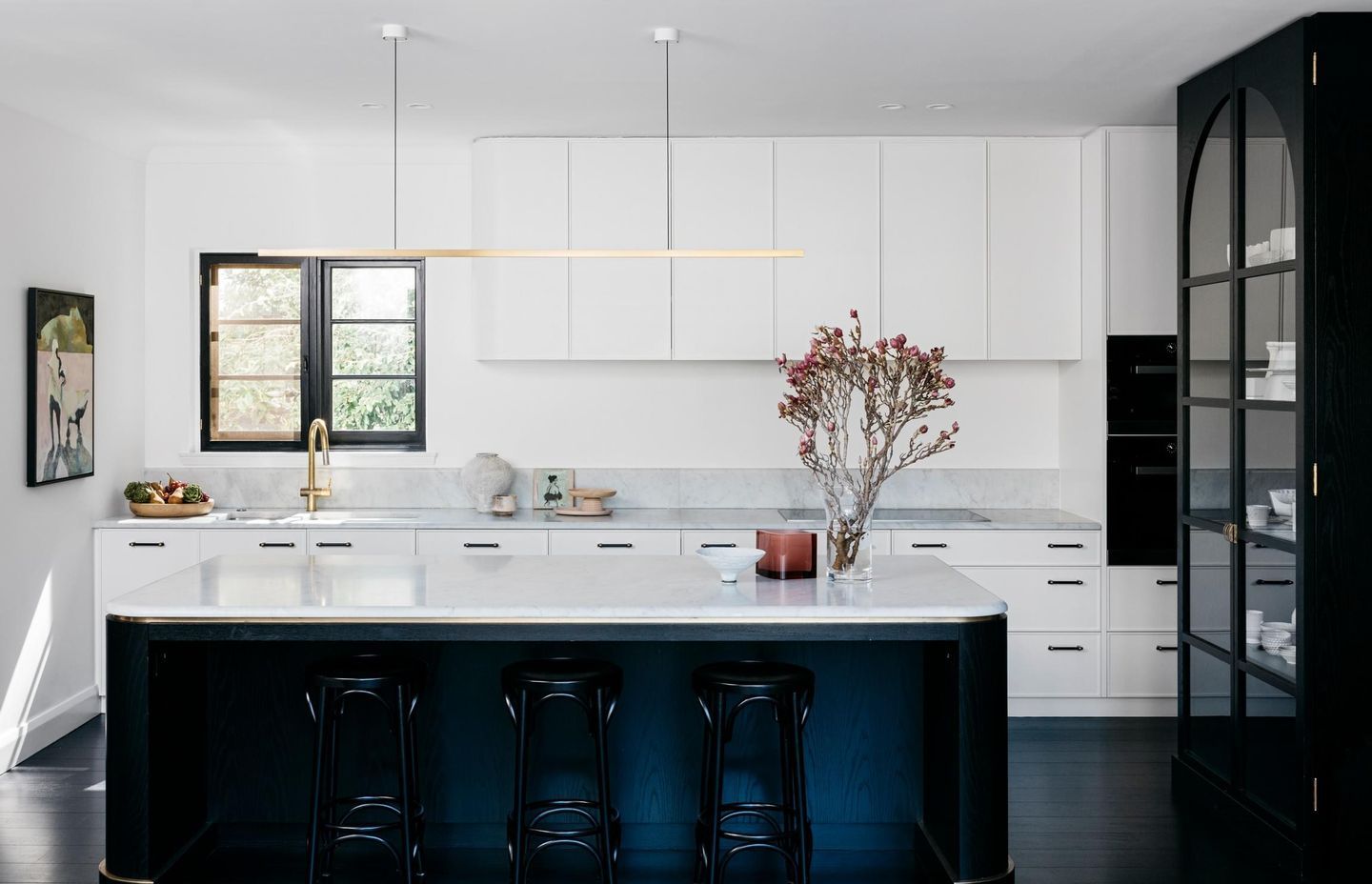 A single piece of stone used for bench tops and splashbacks reduce the risk of mould developing in grout. Curatorial House by Arent&amp;Pyke | Photography by Felix Forest