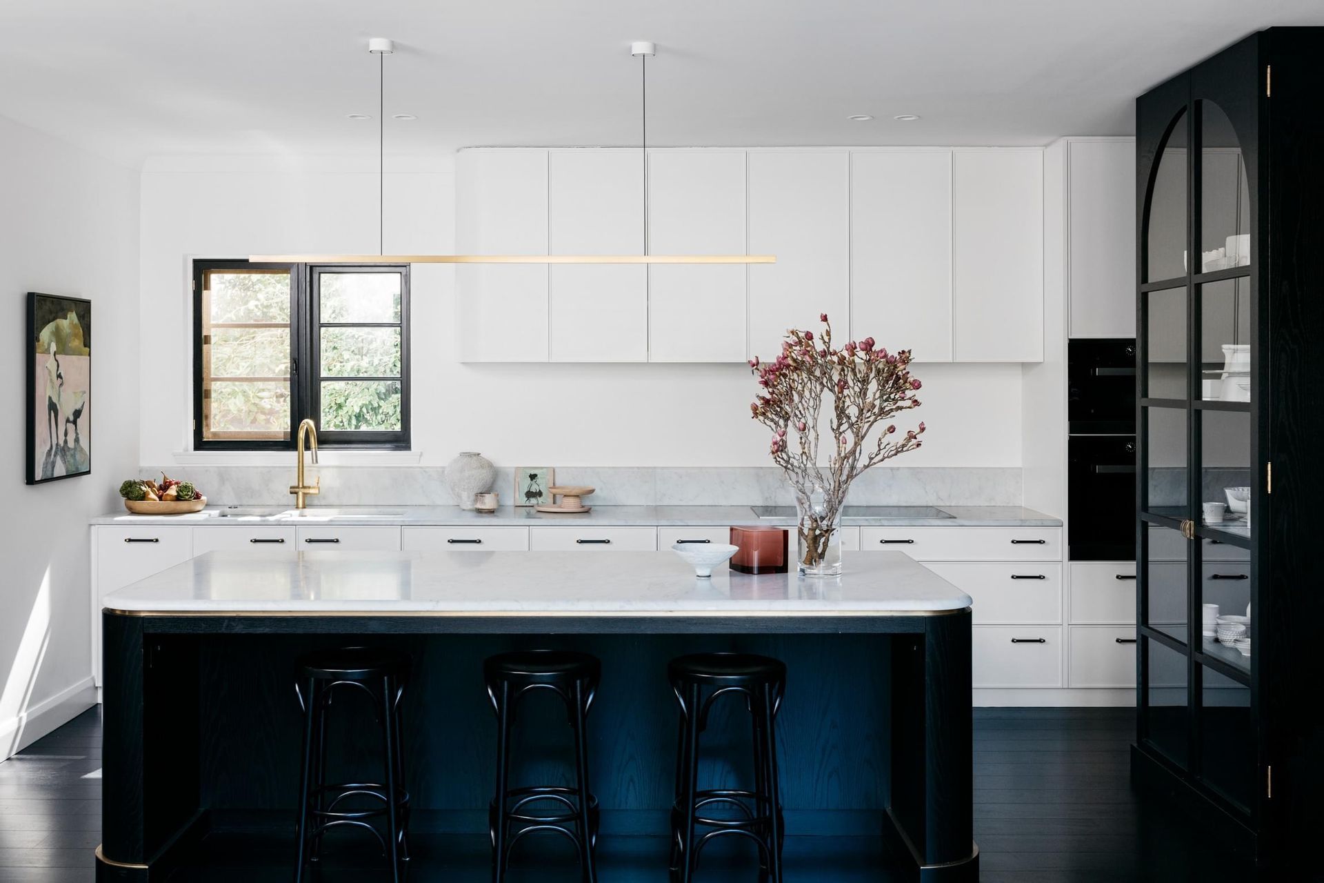 A single piece of stone used for bench tops and splashbacks reduce the risk of mould developing in grout. Curatorial House by Arent&amp;Pyke | Photography by Felix Forest