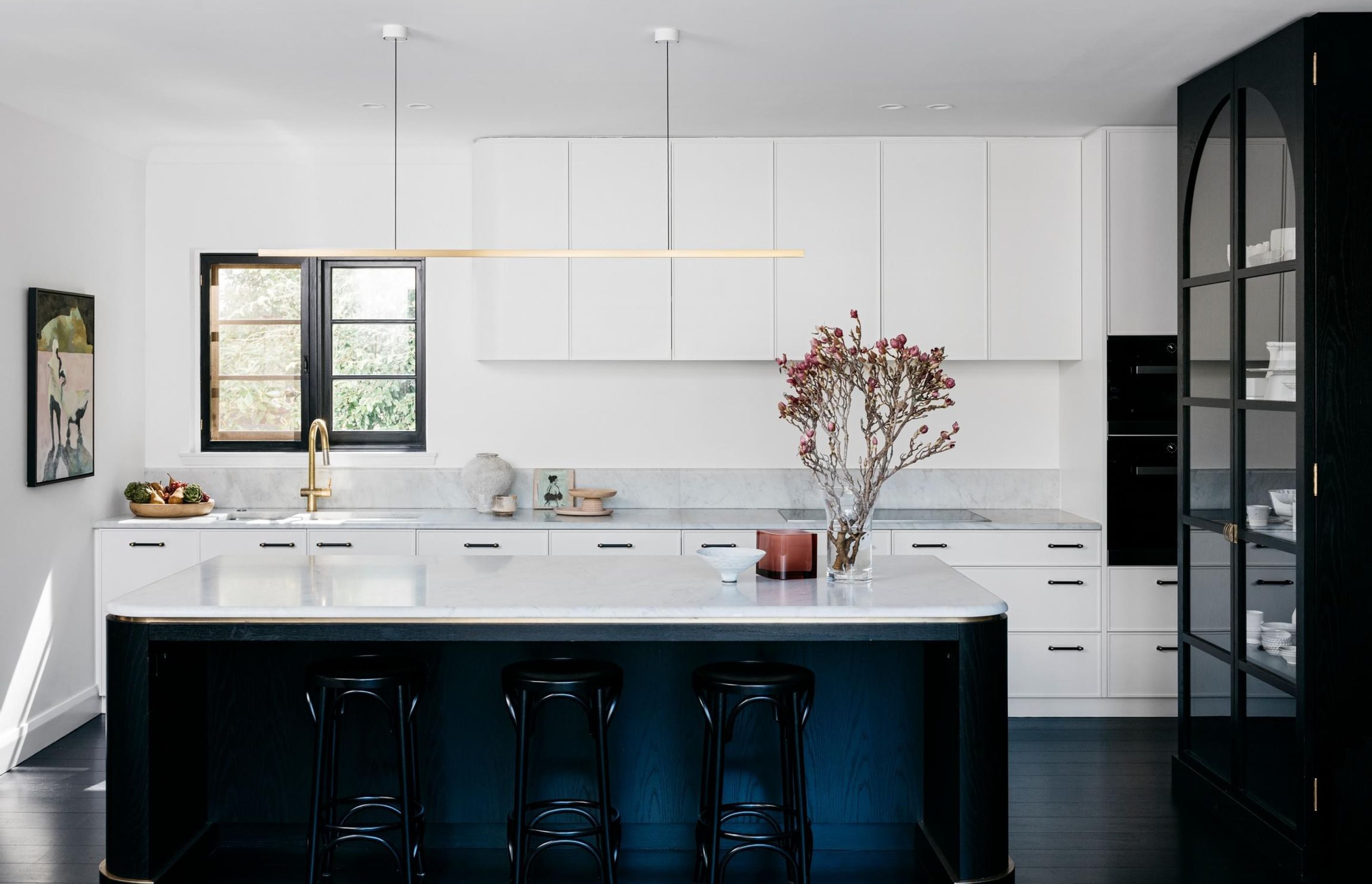 A single piece of stone used for bench tops and splashbacks reduce the risk of mould developing in grout. Curatorial House by Arent&amp;Pyke | Photography by Felix Forest