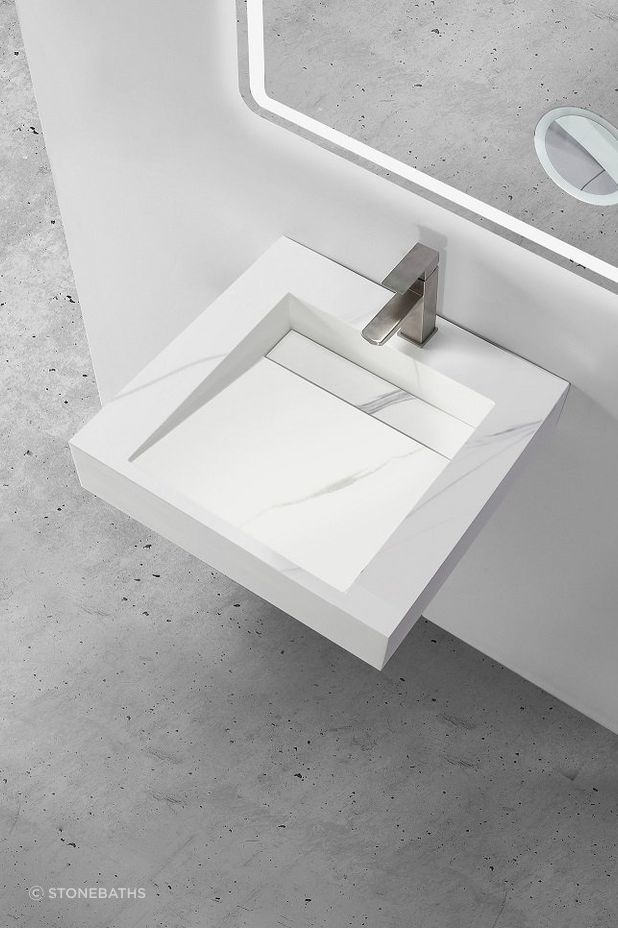 The Marble Custom Wall Hung Hugi Basin Collection by Stonebaths enhances the sense of space.