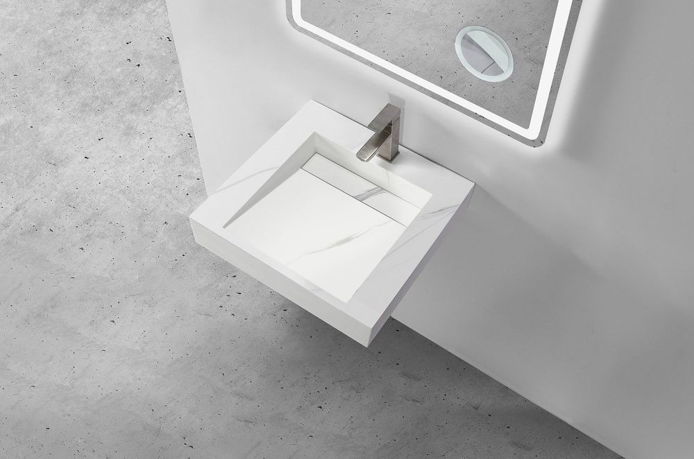 The Marble Custom Wall Hung Hugi Basin Collection by Stonebaths enhances the sense of space.