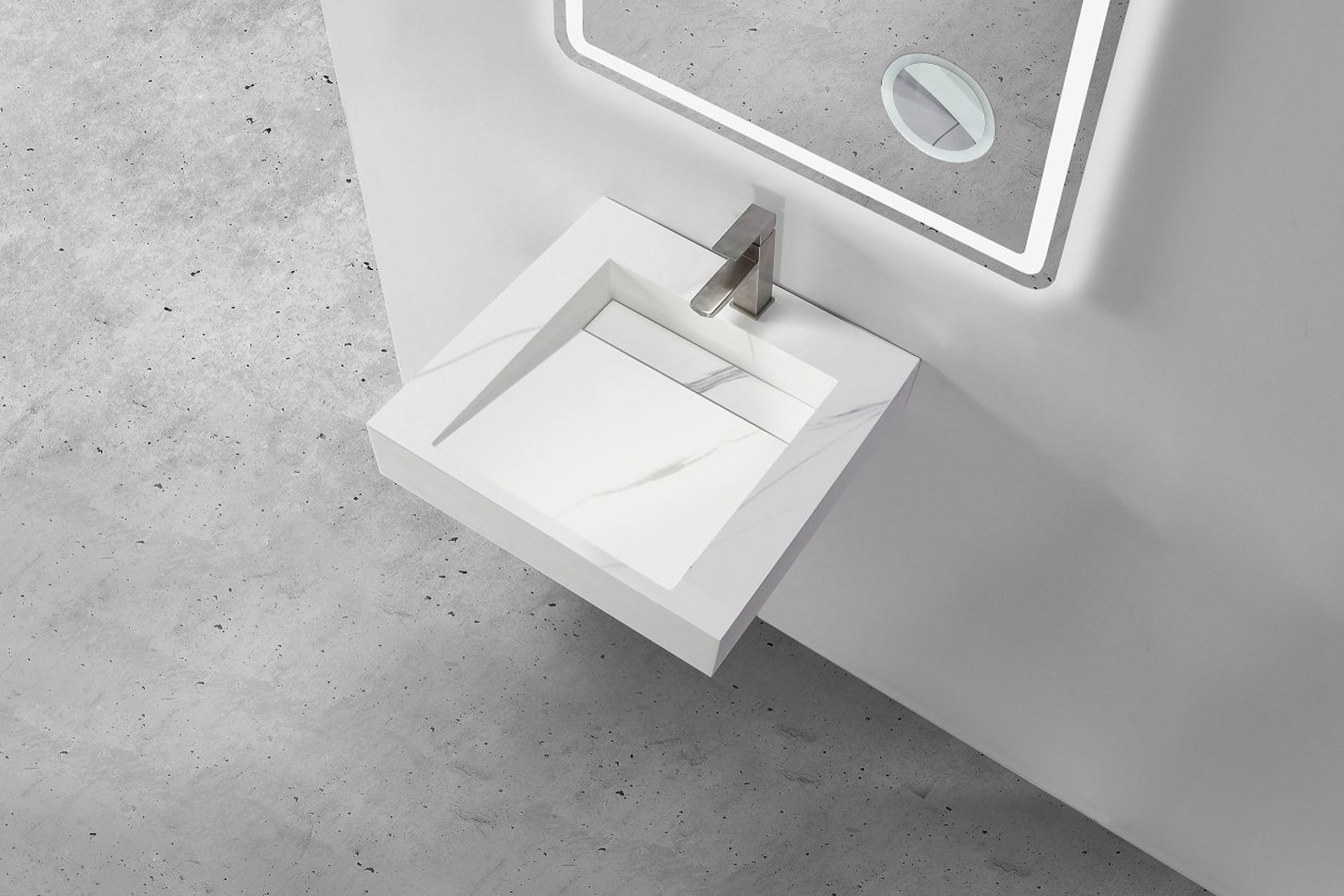 The Marble Custom Wall Hung Hugi Basin Collection by Stonebaths enhances the sense of space.