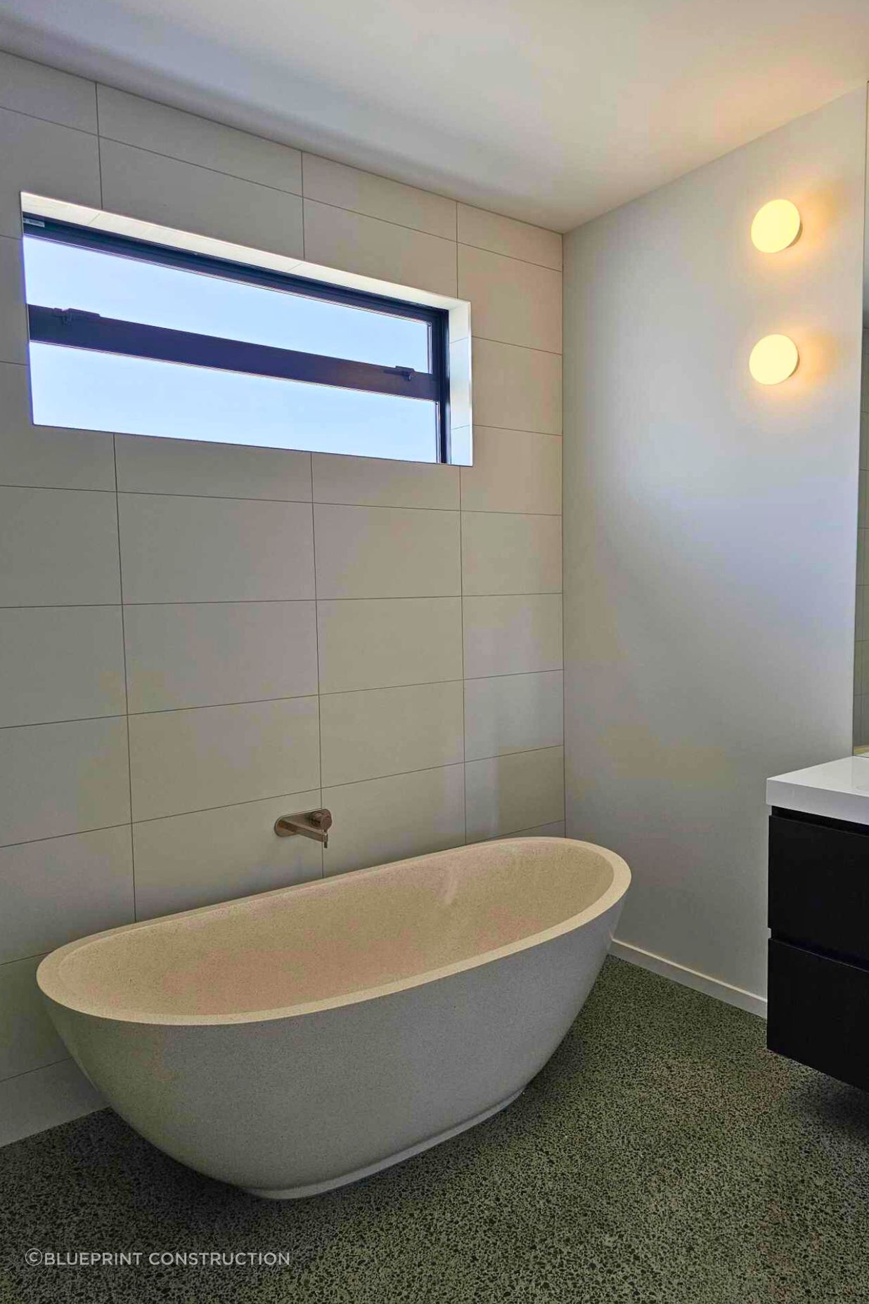 The bathroom is a perfect retreat with its luxurious freestanding stone bath.
