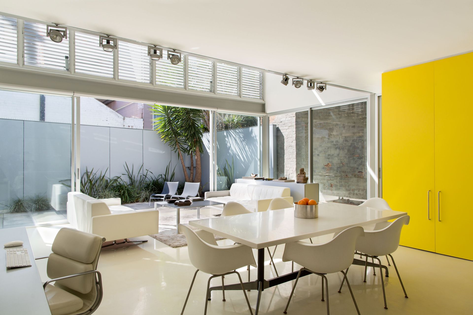 Louvred windows are an excellent way to increase ventilation and create an internal breeze. Dodds House by Ian Moore Architects | Photography by Daniel Mayne