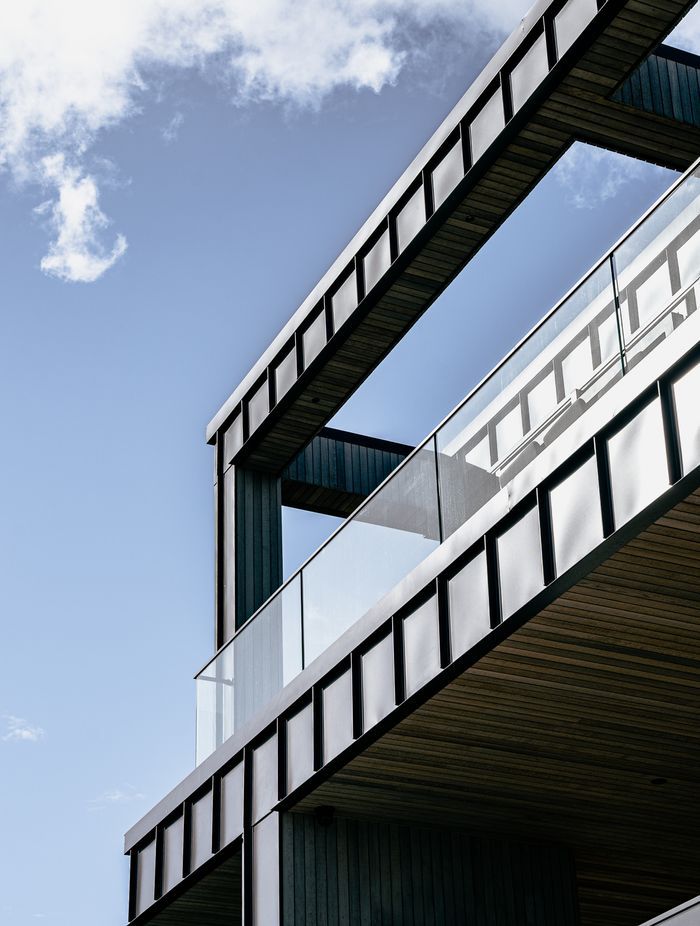 The home makes good use of balconies that direct residents toward the stunning views.