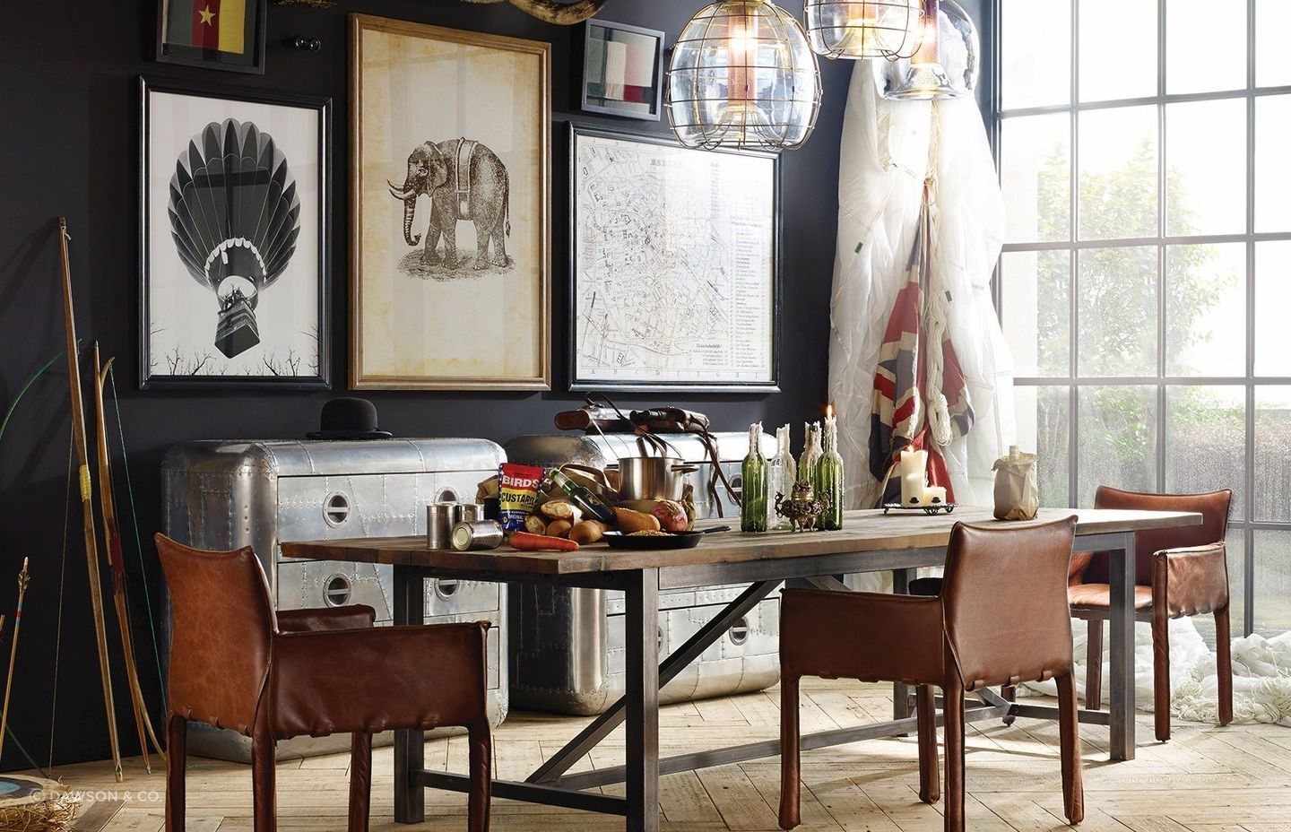The bold and unique Axel Parquet Dining Table by Timothy Oulton complemented by an eclectic collection of wall art for a dining room full of character.