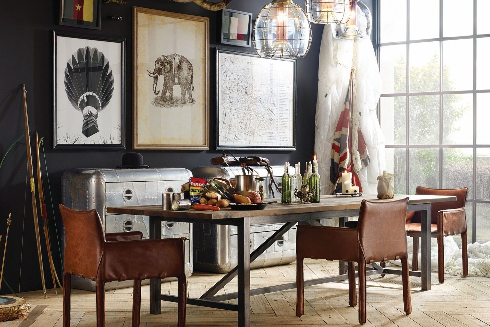 The bold and unique Axel Parquet Dining Table by Timothy Oulton complemented by an eclectic collection of wall art for a dining room full of character.