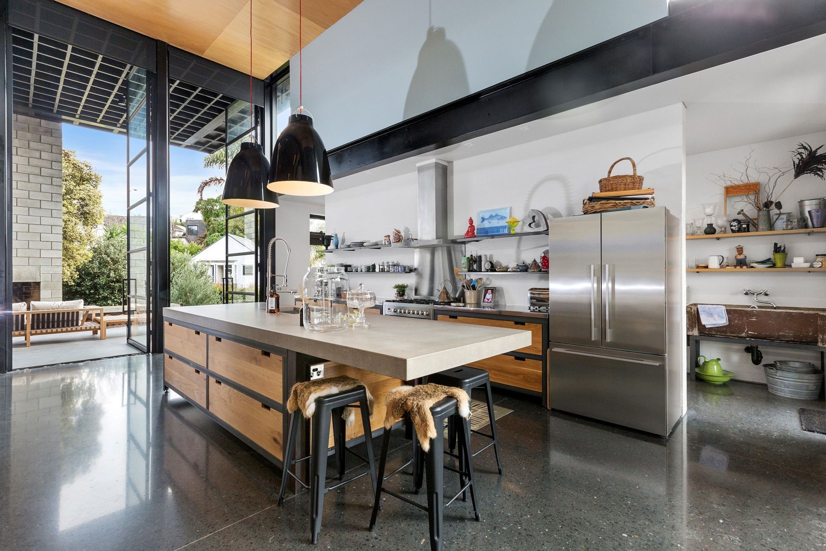 Vast open spaces, steel beams, robust furnishings and more help encapsulate the industrial style aesthetic in this superb home on Apihai Street in Orakei.