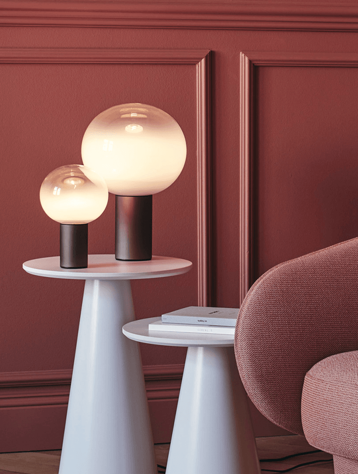 The stunning spherical lamp of the Laguna Table Lamp by Artemide is a real eye-catching feature.