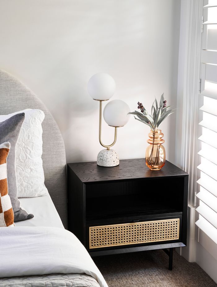In addition to being used for stand-alone side tables, rattan is often incorporated as a design element in hardwood bedside tables, such as this Betty Side Table.