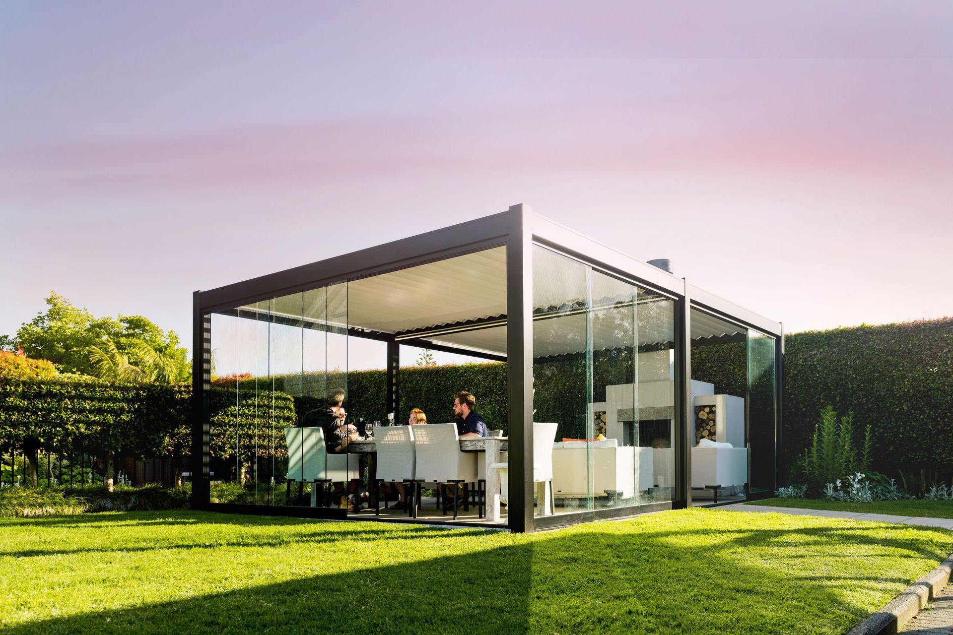 Sliding glass doors or dropdown awnings can be added to Juralco's outdoor living systems to increase their functionality and comfort year-round.