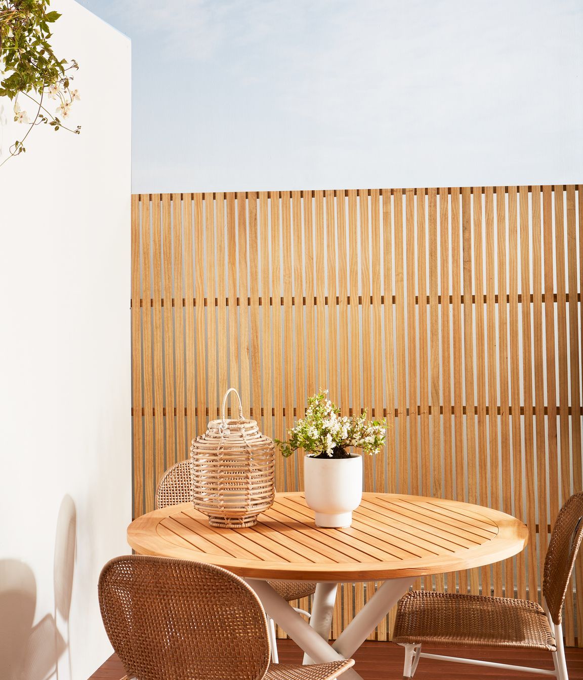 Left wall painted with a base layer of Resene Sandtex, and then painted in Resene Merino. Trellis finished in Resene Natural Wood Oil in Resene Aorangi.