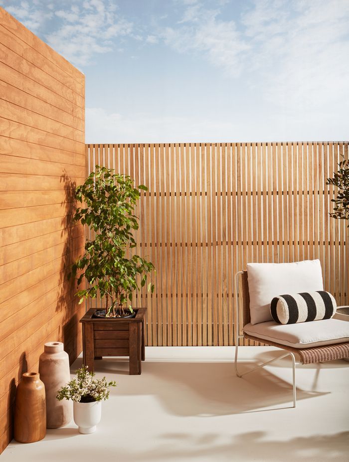 Weatherboards finished in Resene Natural Wood Oil in Resene Egmont. Trellis finished in Resene Natural Wood Oil in Resene Aorangi.