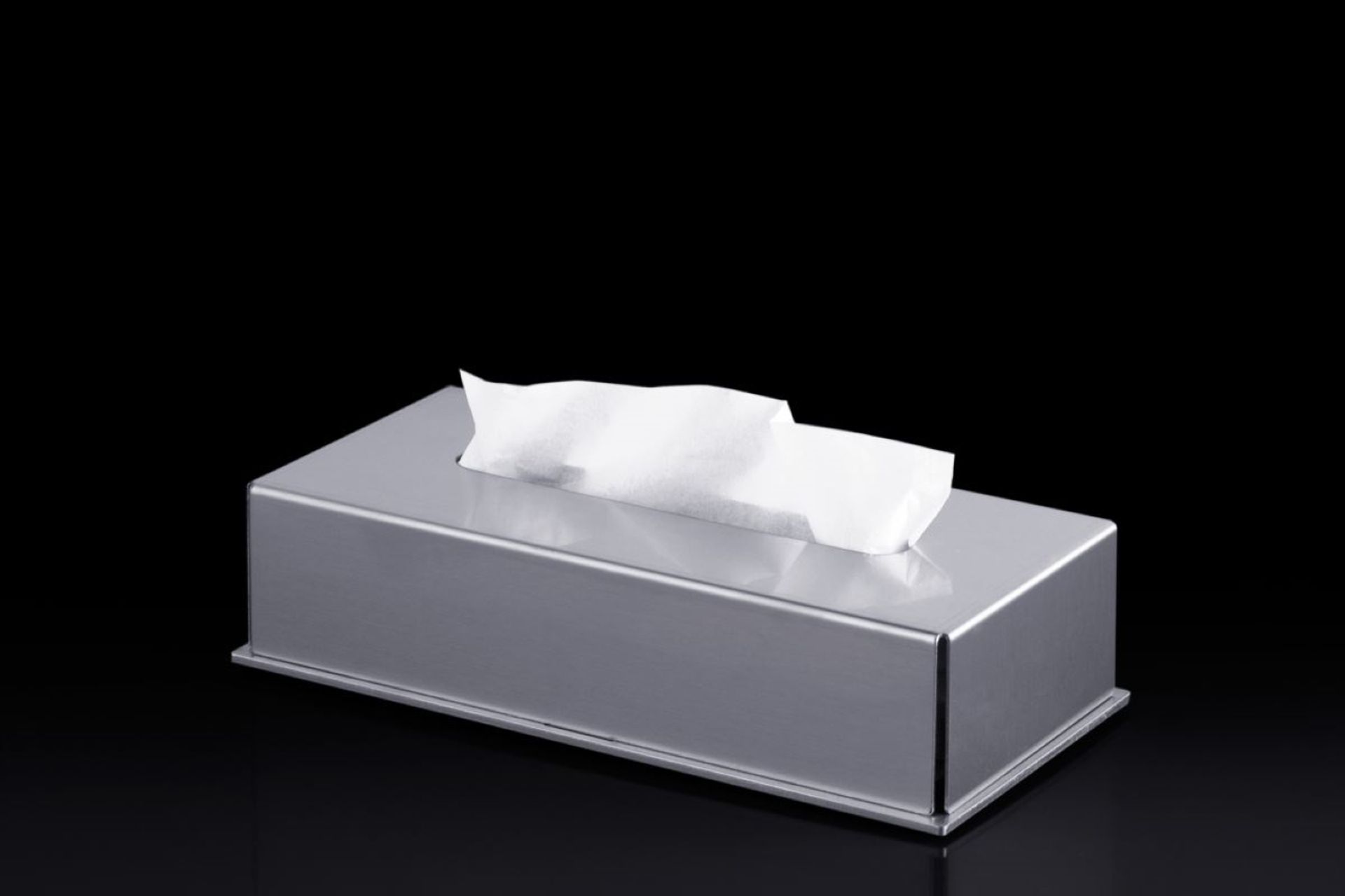 The Blade Tissue Box Holder provides a refined aesthetic and protects tissue boxes from moisture.