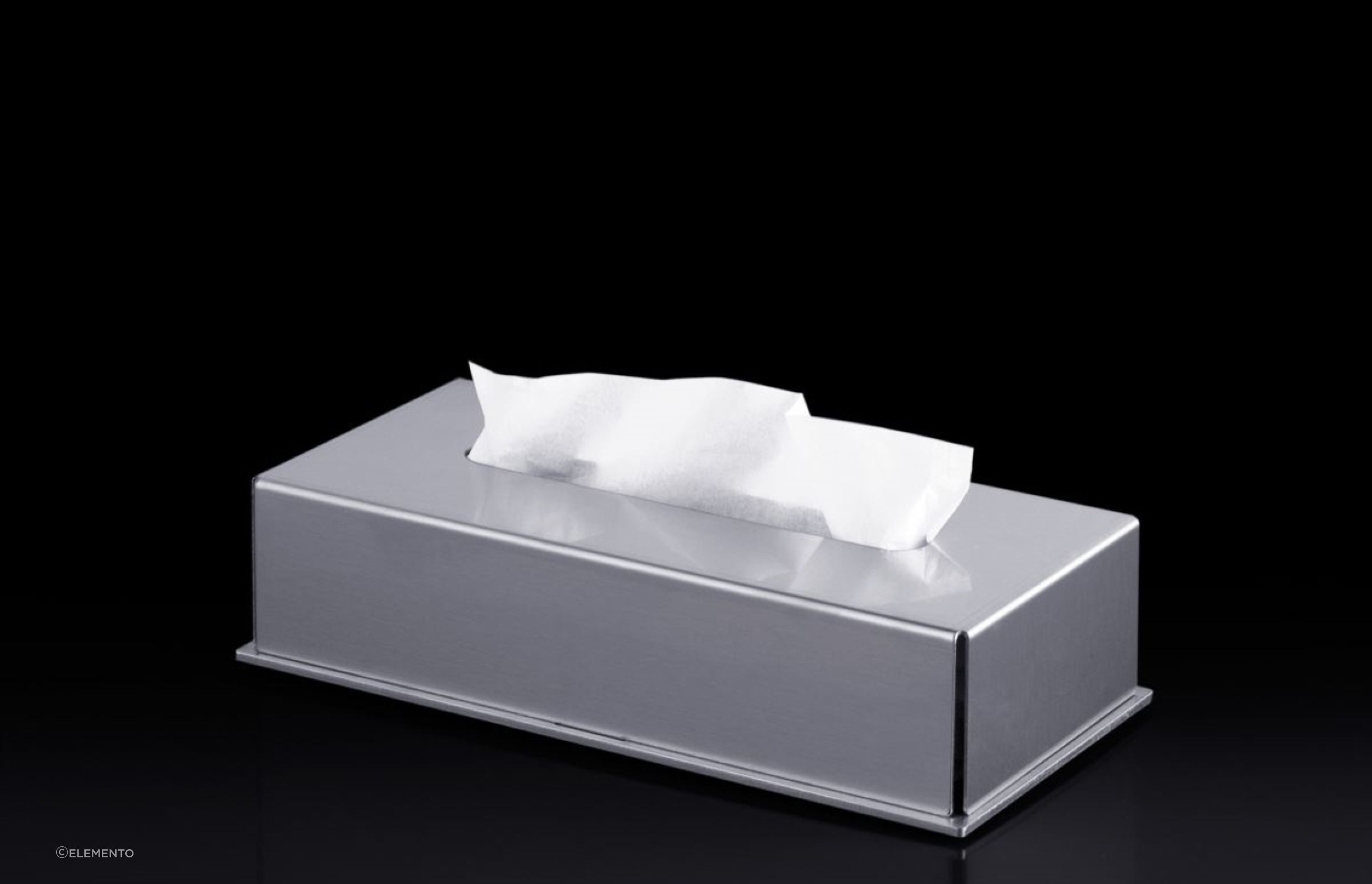 The Blade Tissue Box Holder provides a refined aesthetic and protects tissue boxes from moisture.