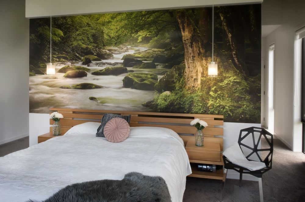 Artistic choices, like this beautiful feature wall in this lovely home in Kerikeri, can personalise your space in a style that is unique to your passions and interests.
