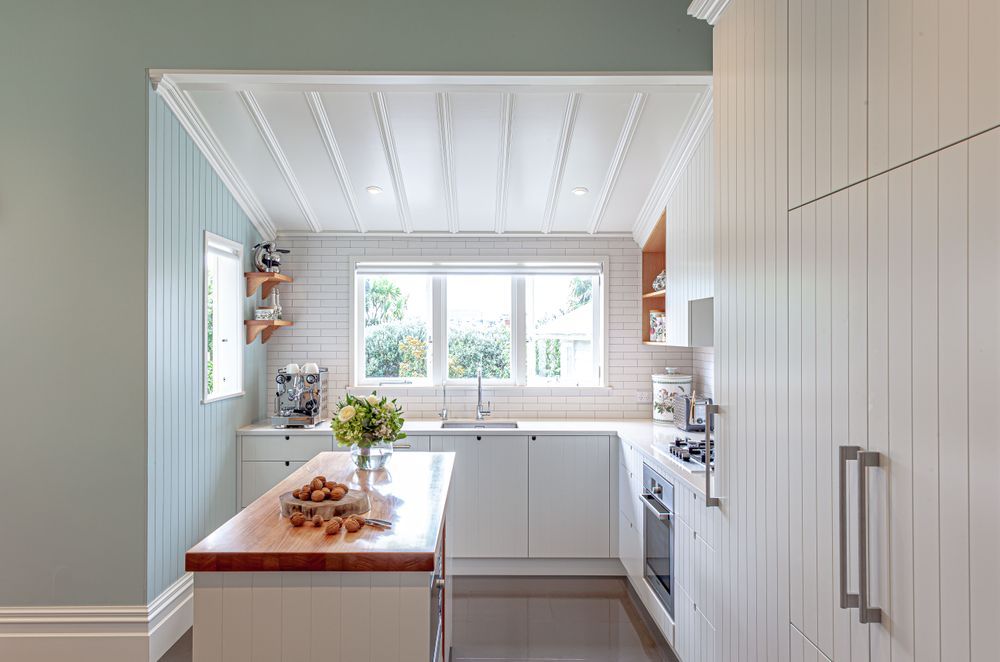 A subtle introduction of colour in this kitchen feels fresh, perfect for mornings spent gathered around the island bench | Grey Lynn Kitchen by Celia Visser Design