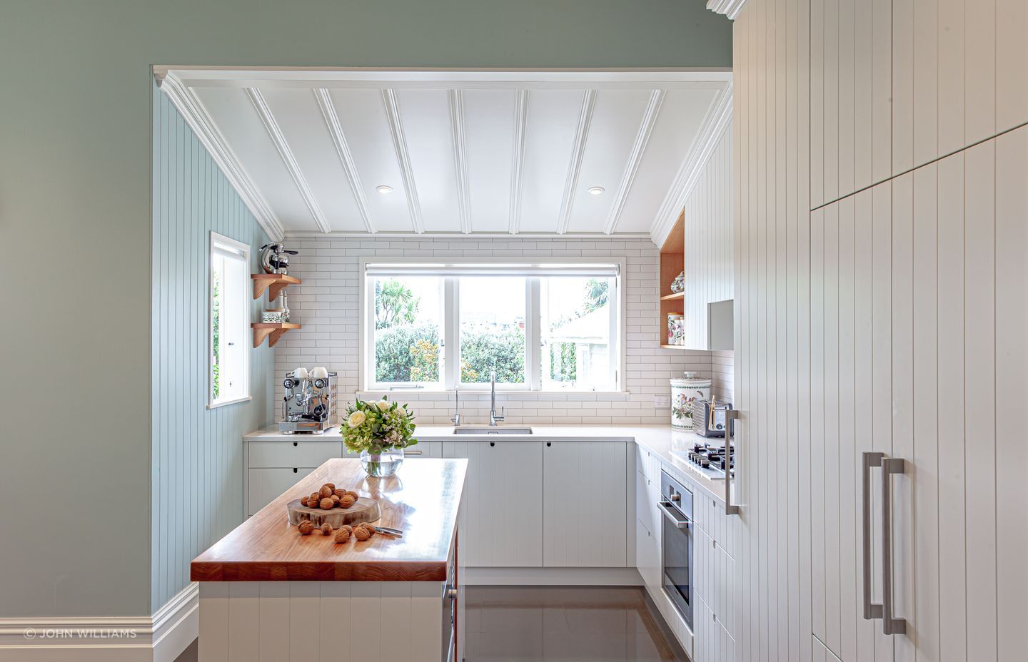 A subtle introduction of colour in this kitchen feels fresh, perfect for mornings spent gathered around the island bench | Grey Lynn Kitchen by Celia Visser Design
