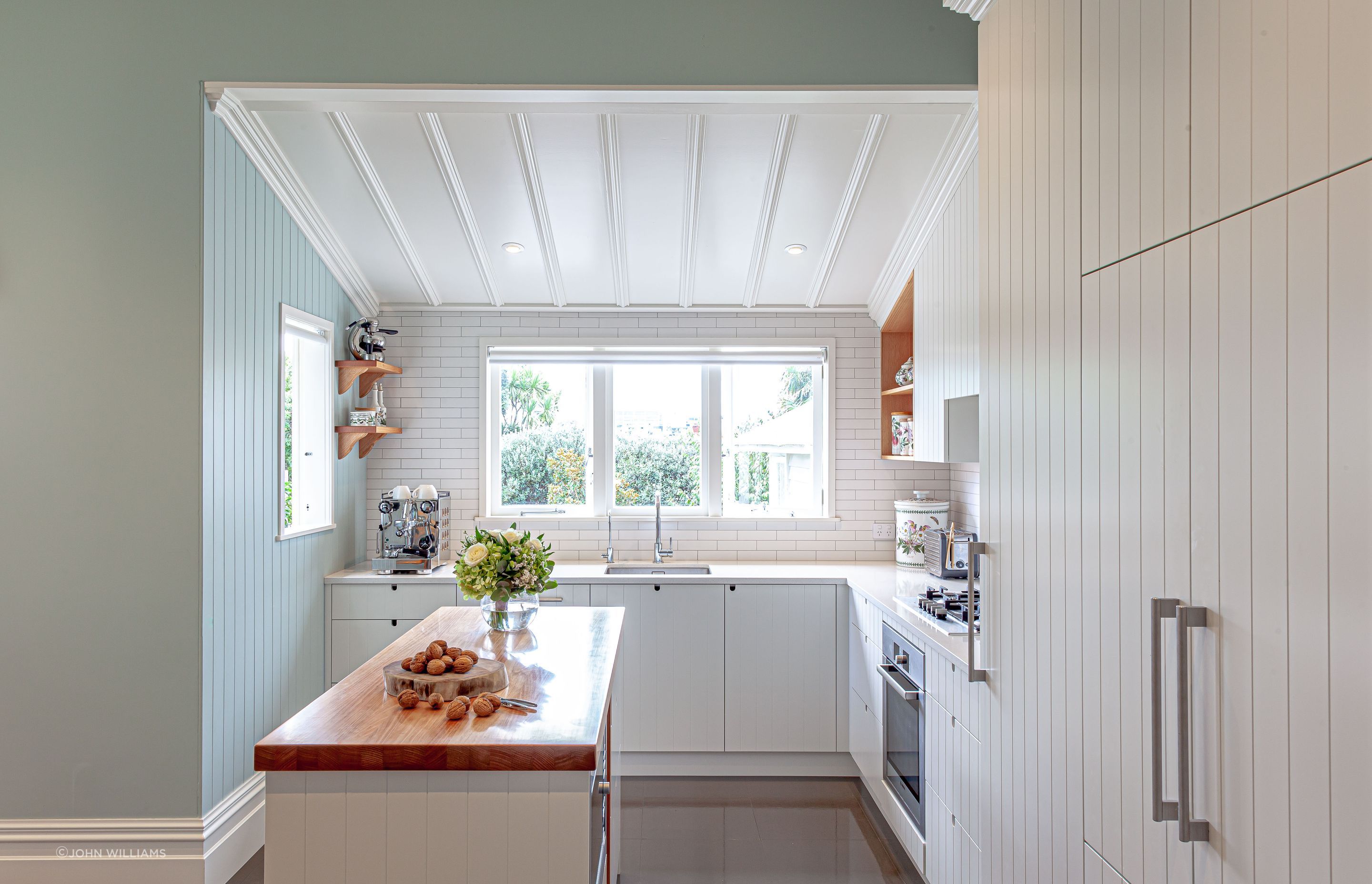 A subtle introduction of colour in this kitchen feels fresh, perfect for mornings spent gathered around the island bench | Grey Lynn Kitchen by Celia Visser Design