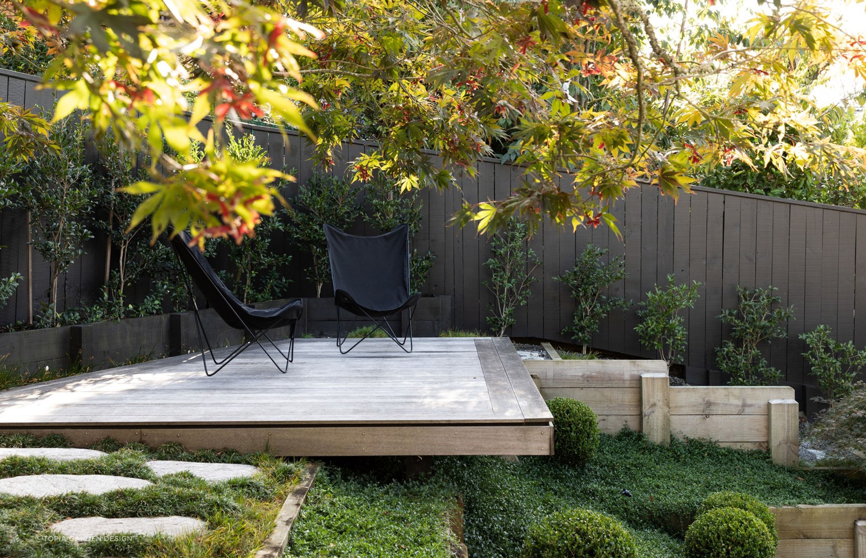 A secluded spot in a corner of a Japanese inspired garden in Crocus Place.