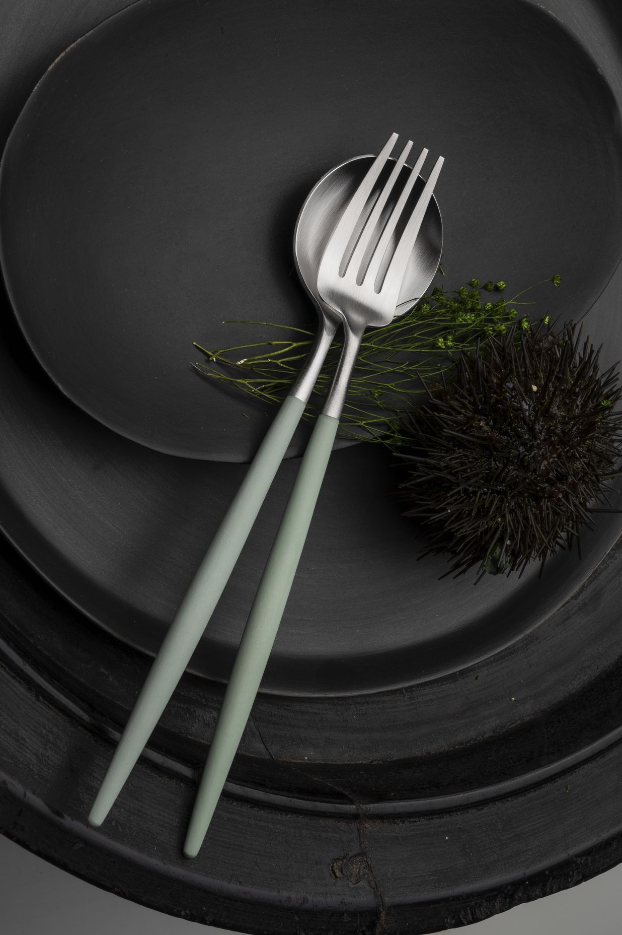 The Cutipol Goa cutlery sets (shown here in Celadon) feature sleek resin handles.