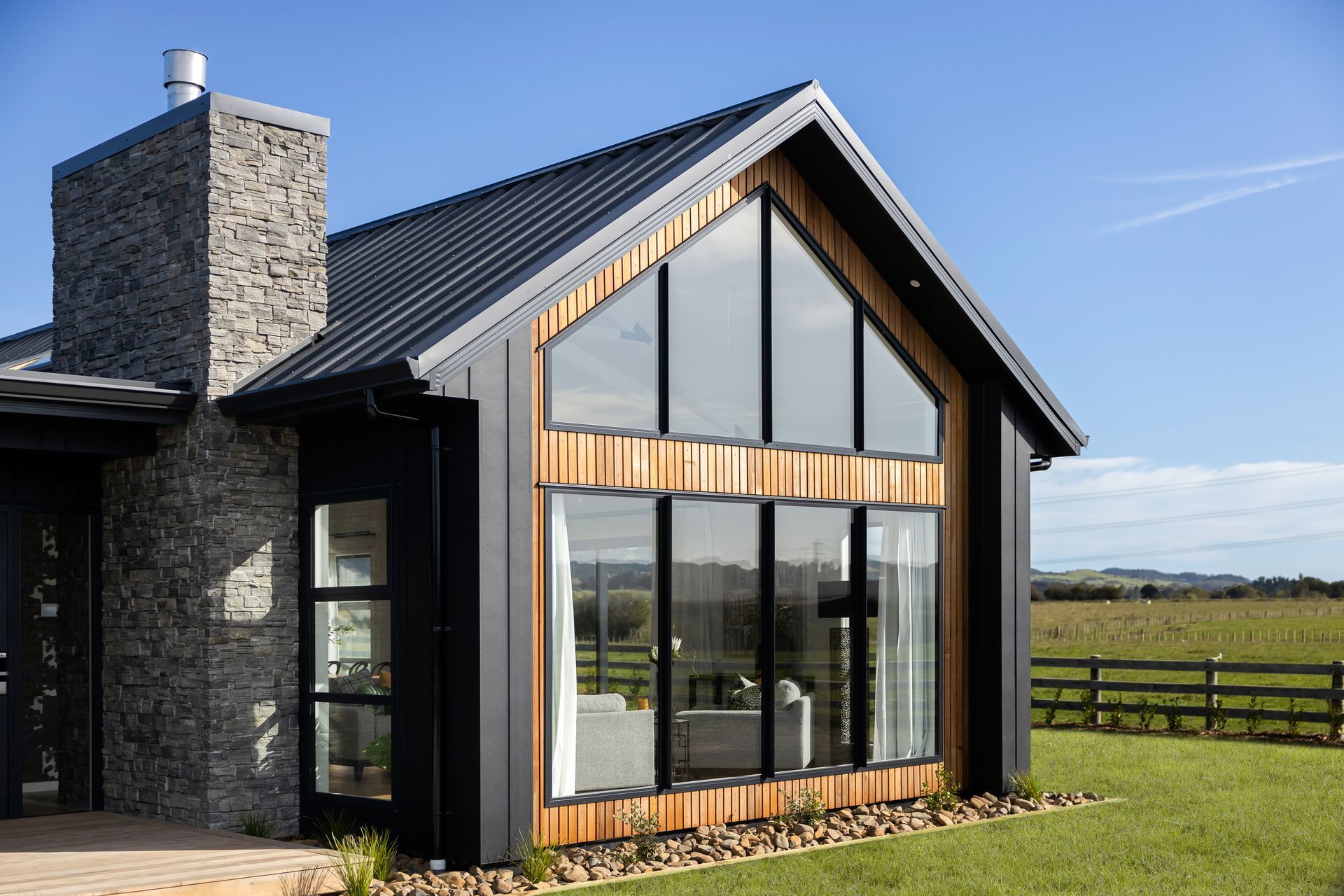 The four-bedroom house is characterised by a traditional, full-sloping gable roof.