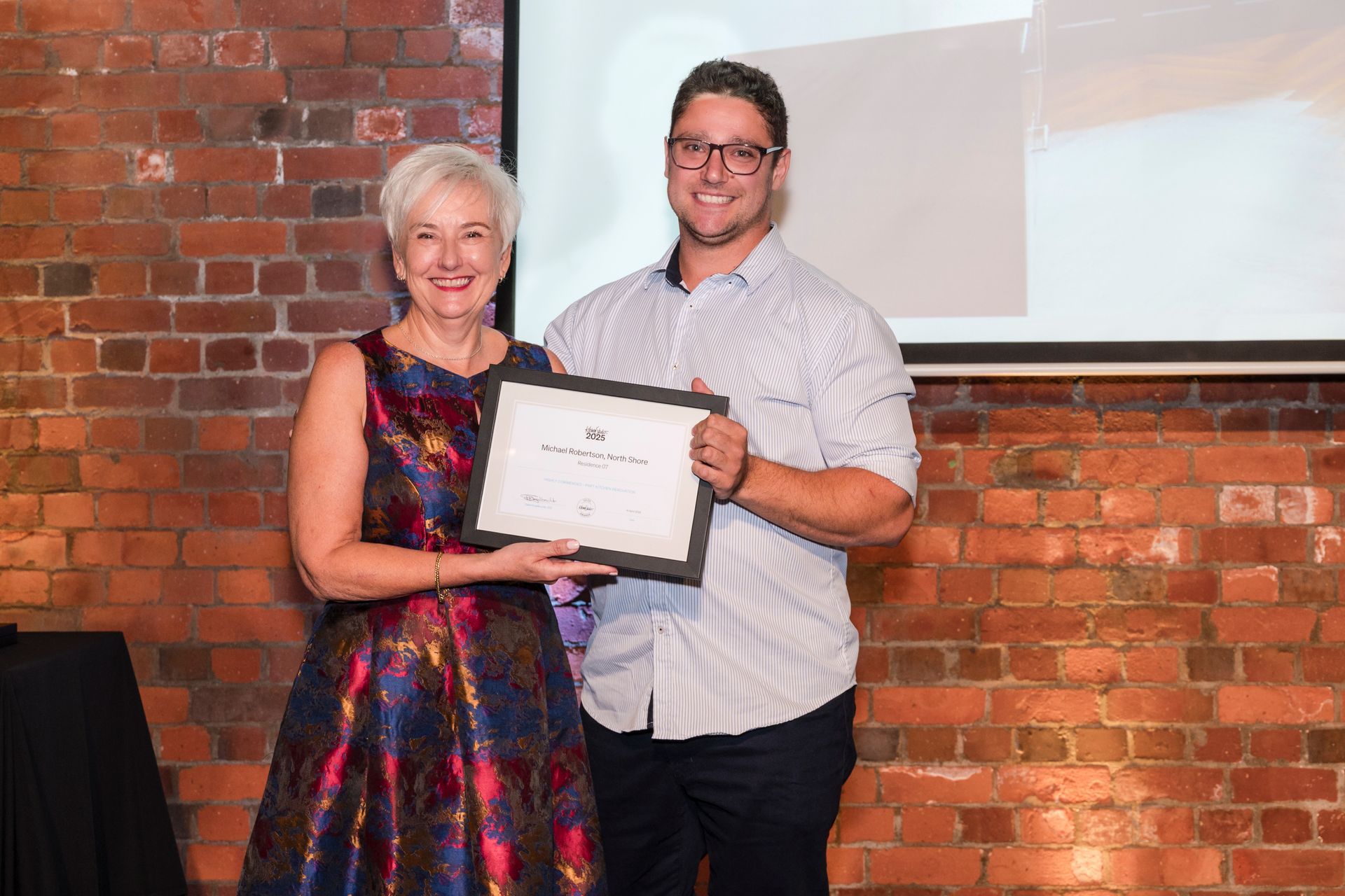 Michael Robertson receiving Kitchen of the Year 2025 and People’s Choice 2025 awards.