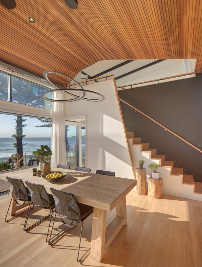The sculptural pendant gives a nod to the curvacious form of the ceiling.