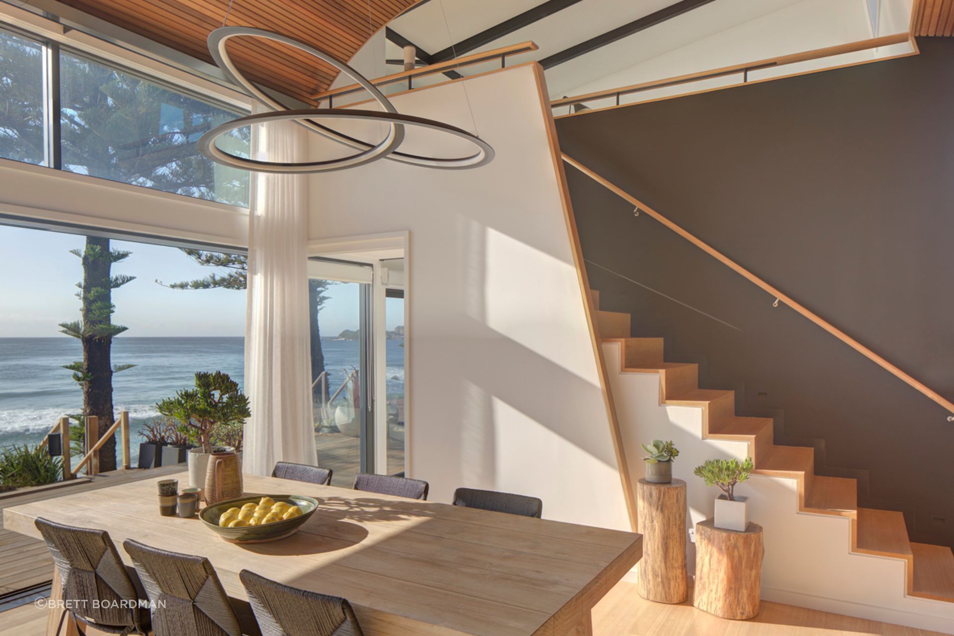 The sculptural pendant gives a nod to the curvacious form of the ceiling.