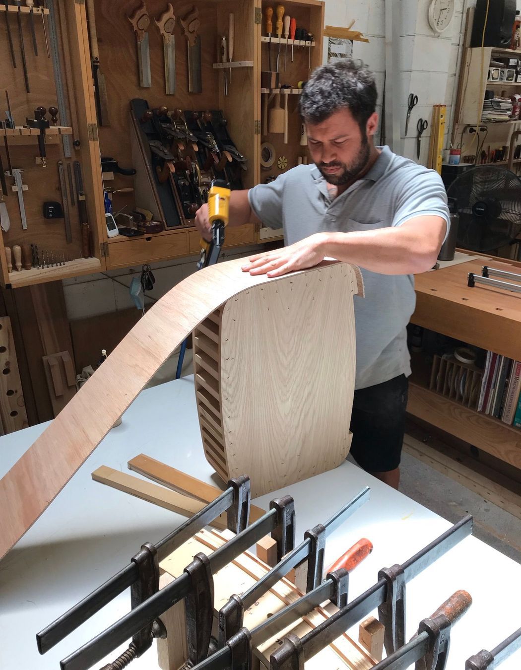 Four teams of local makers specialising in steelwork, cabinetry and upholstery work collaboratively on every piece.