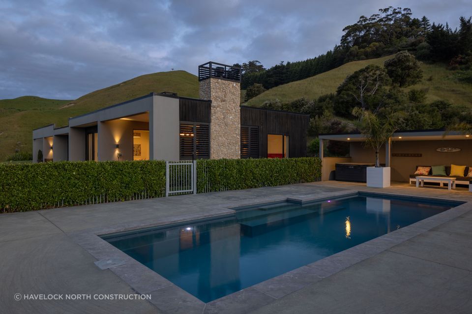 Located up high on Te Mata Peak, this home features vertical shiplap cedar and Celcrete cladding, working harmoniously with Hawke's Bay's golden landscape.