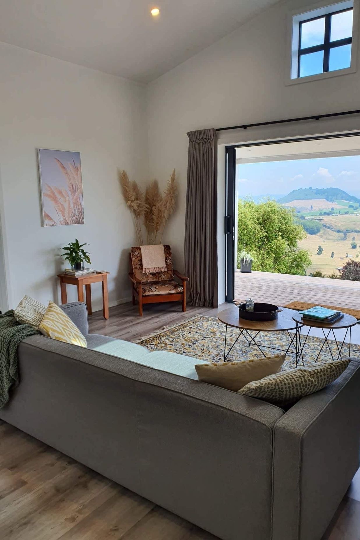 The open-plan living area features a pitched ceiling to make the space feel larger.