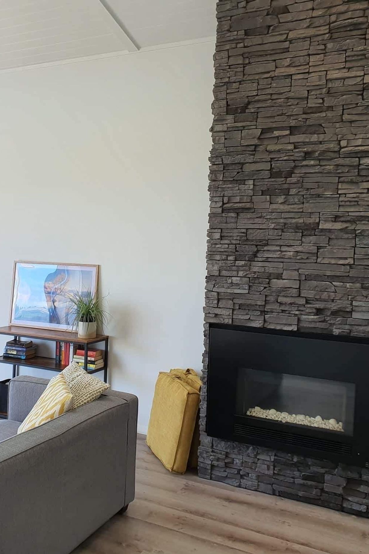 A schist stone fireplace adds a ‘wow-factor’ to the space.