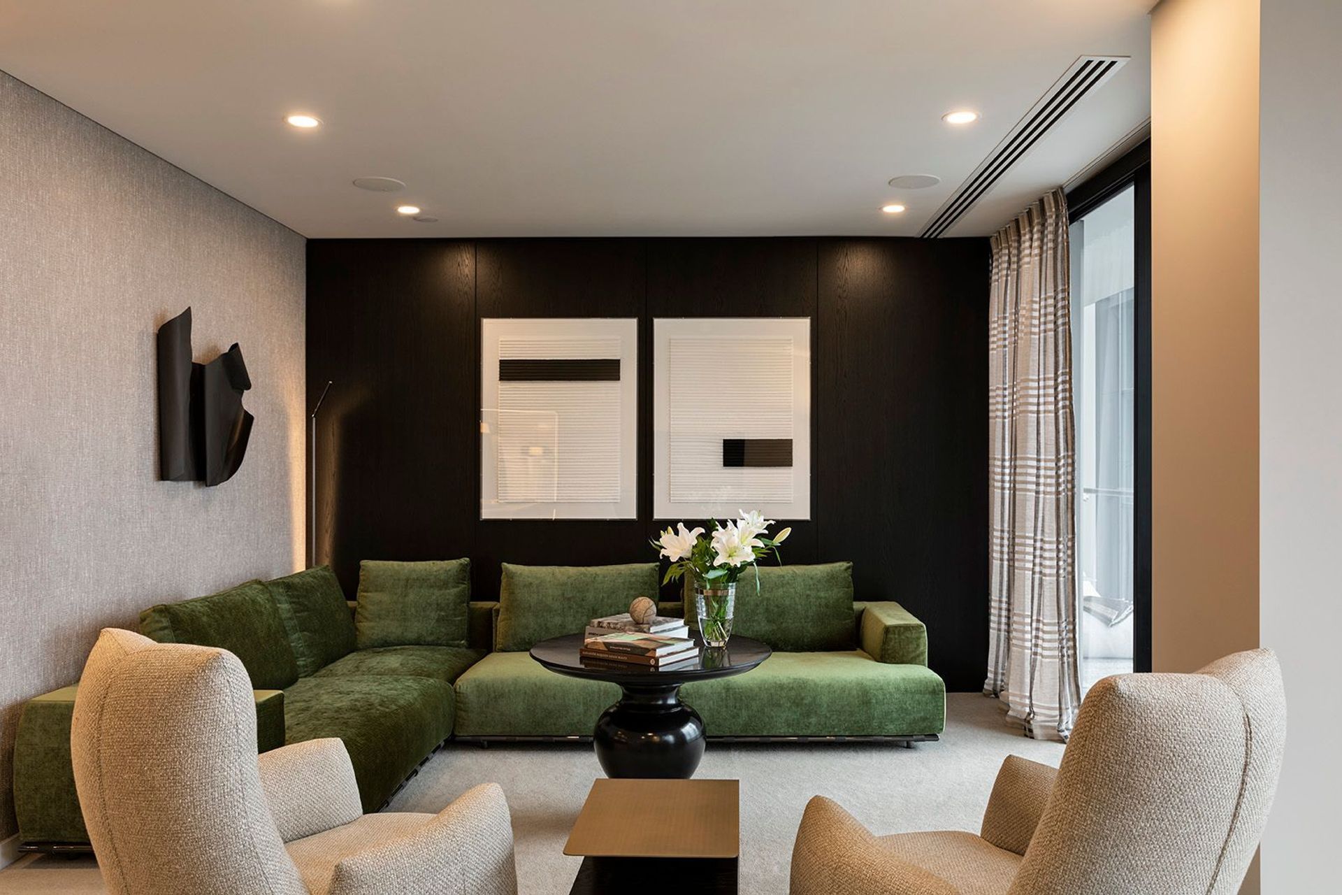 The contemporary furniture in this apartment is softened with timeless textures and finishes, complemented by personal touches and a thoughtful blend of ambient and task lighting.
