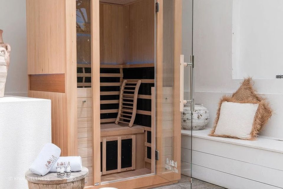 Infrared saunas use infrared light via heating panels to directly warm the body.