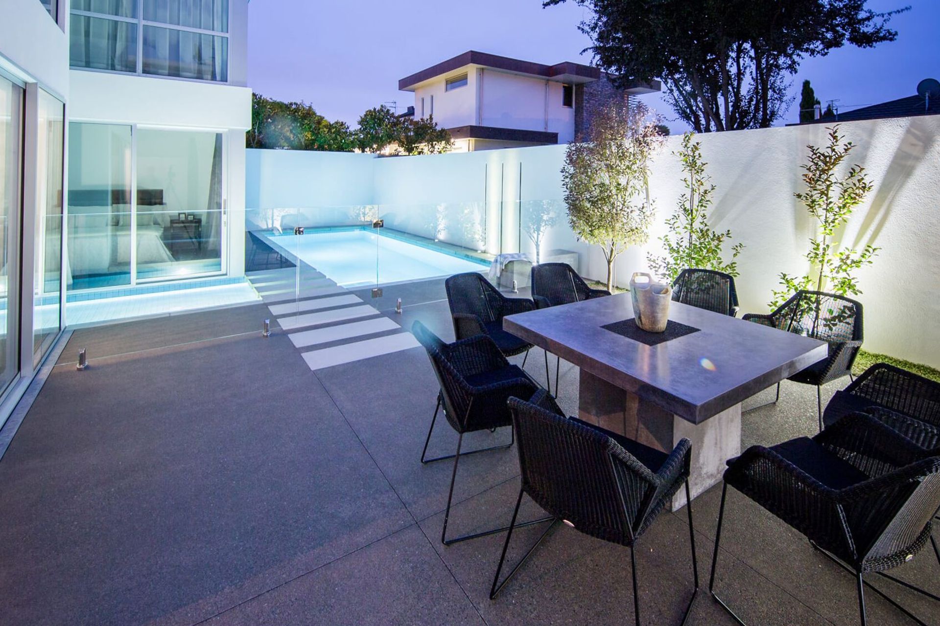 A Merivale home with a stylish pool that laps up against the side of the house.