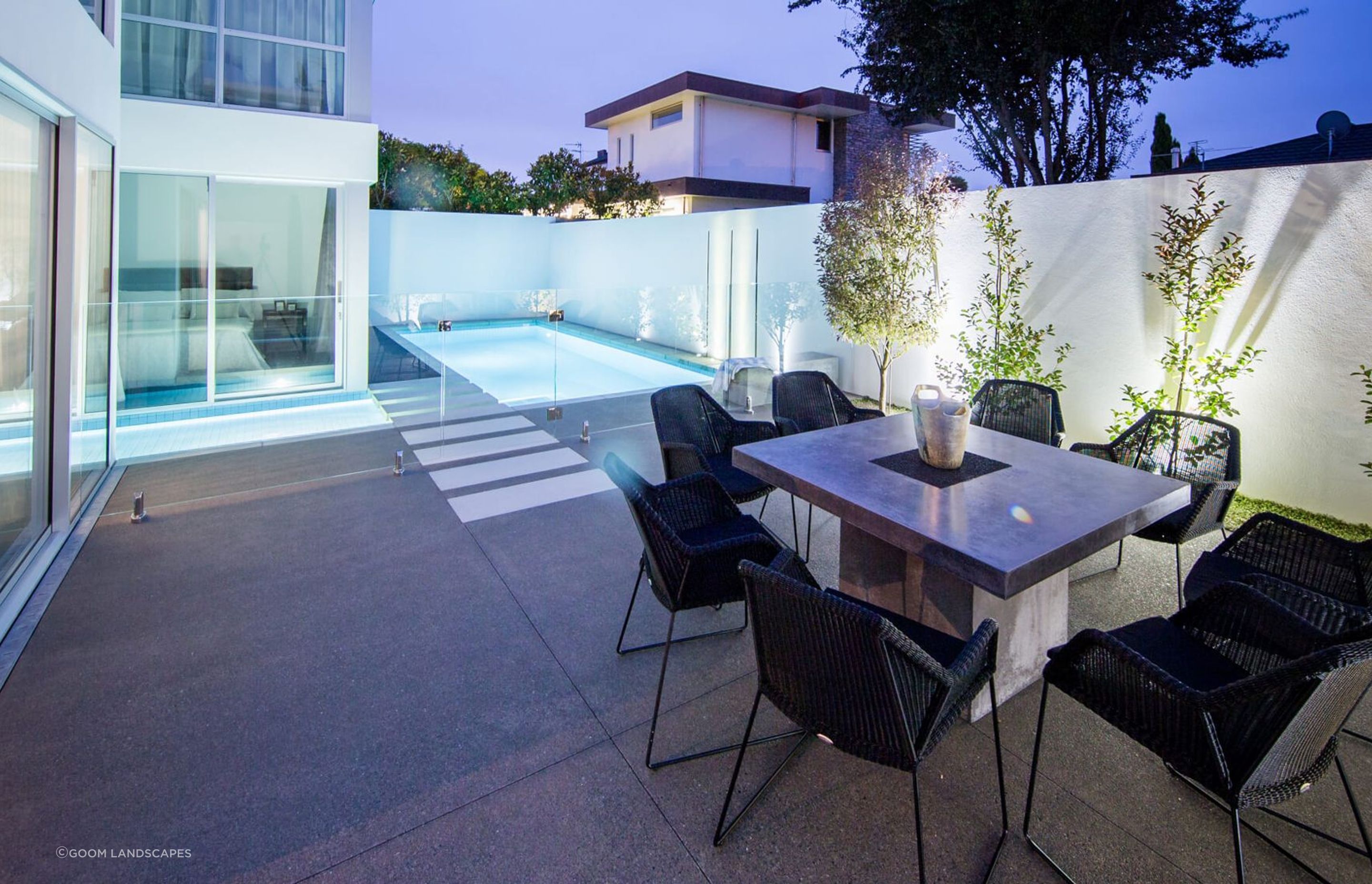 A Merivale home with a stylish pool that laps up against the side of the house.