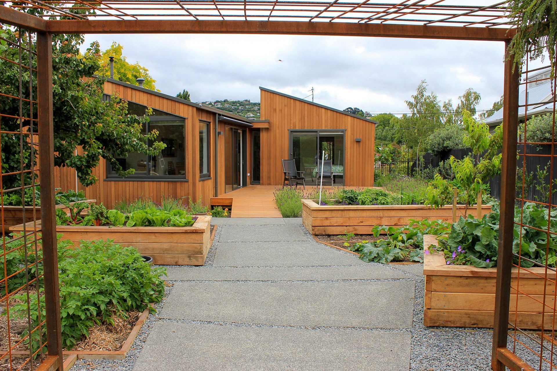 A productive garden that is easily accessed from this Opawa home thanks to thoughtfully designed deck and paving.